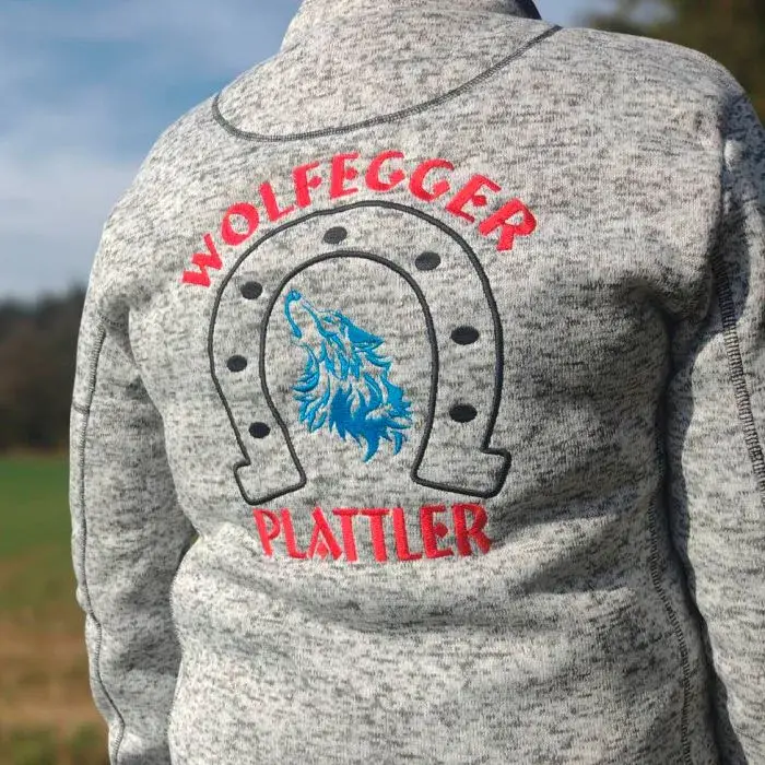 Graue Strickjacke mit besticktem Rücken